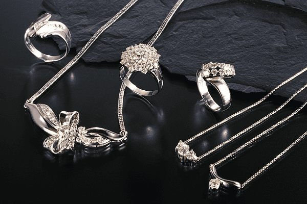 Handmade rings and diamond necklaces arranged together